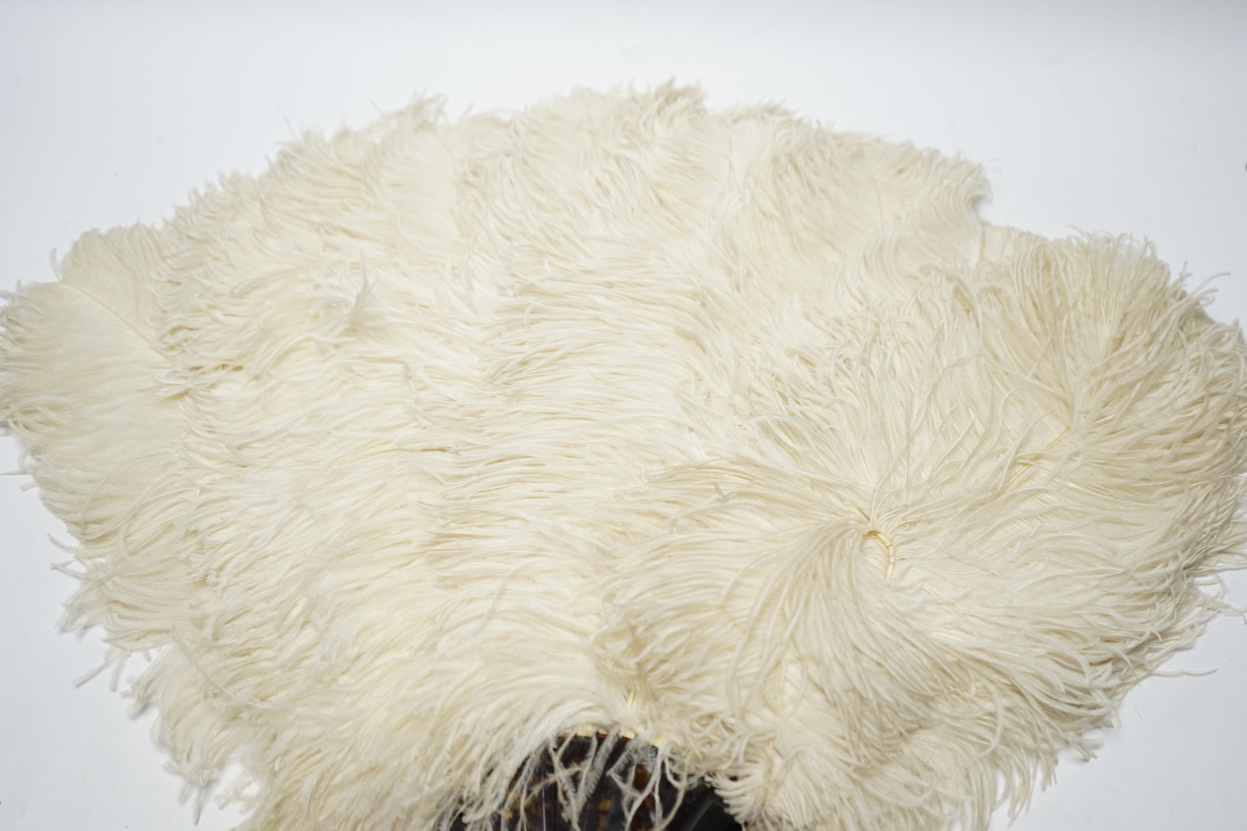 A 1930's boxed French cream Ostrich feather fan with tortoiseshell guards